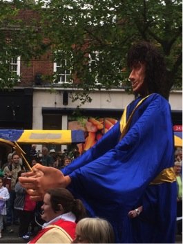 Photo of giant puppet of St Alban in procession