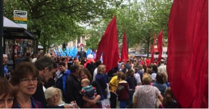 Photo of crowds with banners in St Albans procession route